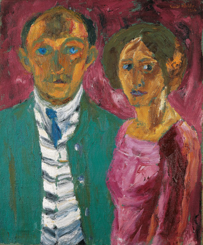 Two people &ndash; a man and a woman &ndash; stand side by side against a pink-red background; the man, with bright blue eyes, looks straight ahead, while the woman looks to the right.